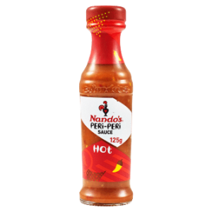 A 125g bottle of Nando Peri Sauce, featuring Nando's signature Peri-Peri Hot Sauce. The bottle has a red cap and a vibrant red and orange label design with the iconic Nando's logo and a pepper graphic indicating its hotness. The label also includes the text "125g" and "Hot".