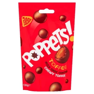 A red pouch of Poppets pouch with milk chocolate-coated chewy toffee pieces. The front of the bag shows the Poppets logo and depicts a toffee piece broken in half, revealing its chewy inside. The bag is 130 grams.